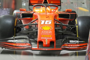 A red formula 1 race car with number 16.
